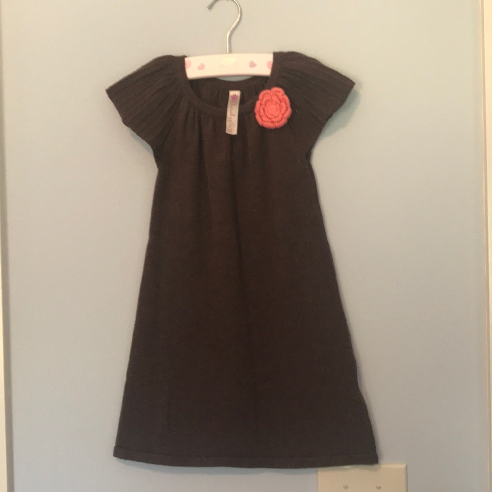 Brown dress with coral pink crochet bow detail